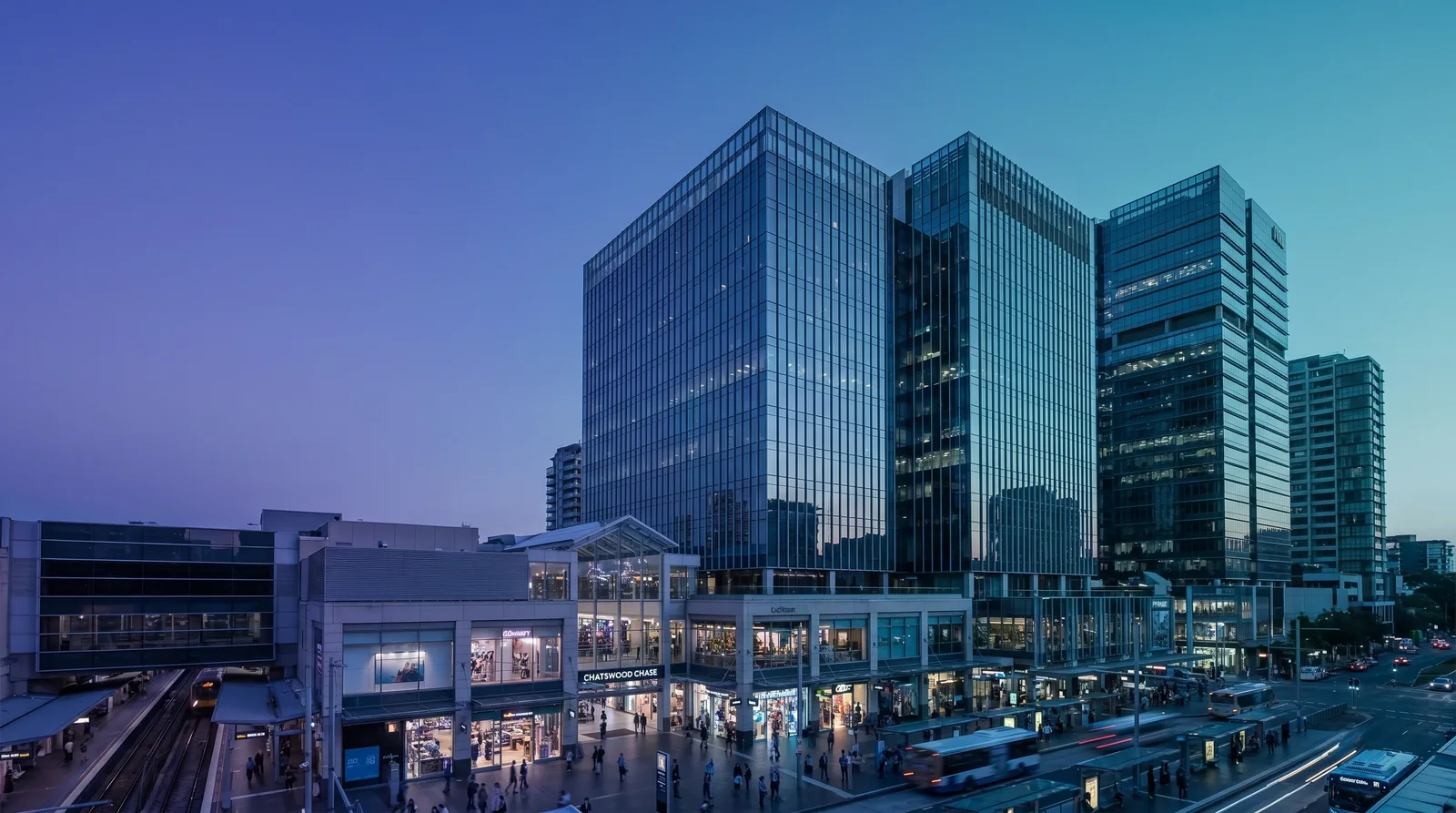 Chatswood's glass apartment towers above Victoria Avenue at dusk